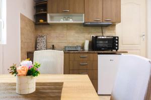 Kuchyň nebo kuchyňský kout v ubytování Apartmani Đorđević
