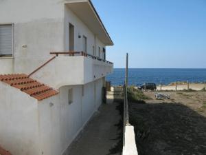 a white building with a view of the ocean at Casa al MARE CON SPLENDIDA VISTA SUL MARE in Petrosino