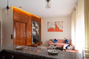 a living room with a couch and a table at Imlil apartment in Azrou