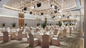 a banquet hall with white tables and chairs at JOUDYAN Red Sea Mall Jeddah By ELAF in Jeddah +34 photos