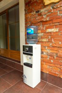 a cooler with a water container on top of it at Apartments MoonRiver 