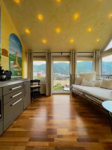 a large room with a bed and large windows at PARK VILLA zentral am Mittelrhein in Boppard