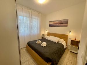 Ένα ή περισσότερα κρεβάτια σε δωμάτιο στο Villa Antonietta 3, tra pineta e mare