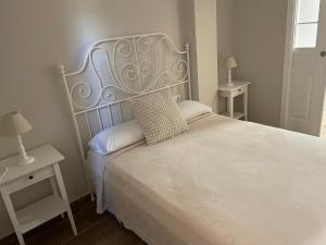 Cama o camas de una habitación en La Casa de los Molineros