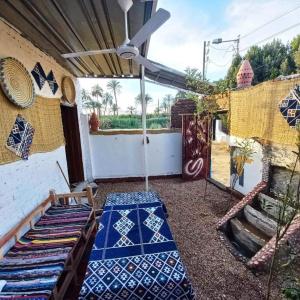 a patio with blue and white tiles on the ground at Julia View in Luxor