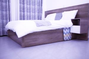 Ліжко або ліжка в номері KIGALI VILLa