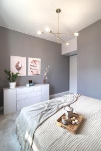 Posteľ alebo postele v izbe v ubytovaní Apartament Topo - Puck, ulica Nowy Swiat 23C + 12 fotografií