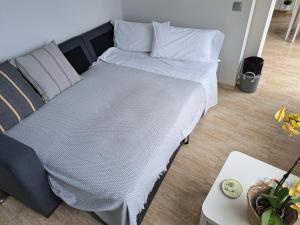Ein Bett oder Betten in einem Zimmer der Unterkunft La Casita del Arco Ático
