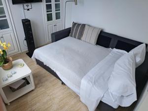 Ein Bett oder Betten in einem Zimmer der Unterkunft La Casita del Arco Ático
