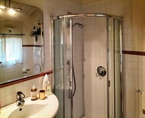 a bathroom with a sink and a glass shower at Catulliana in Verona