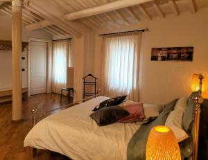 ヴェローナにあるCatullianaのベッドルーム1室(枕2つ付)