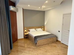 Voodi või voodid majutusasutuse Friendly Hotel toas