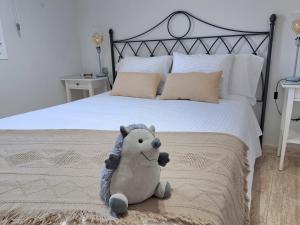 Ein Bett oder Betten in einem Zimmer der Unterkunft La Casita del Arco Ático