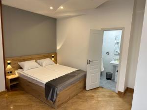 Voodi või voodid majutusasutuse Friendly Hotel toas