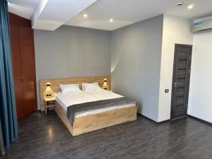 Voodi või voodid majutusasutuse Friendly Hotel toas