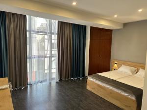 Voodi või voodid majutusasutuse Friendly Hotel toas