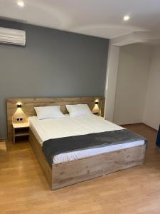 Voodi või voodid majutusasutuse Friendly Hotel toas