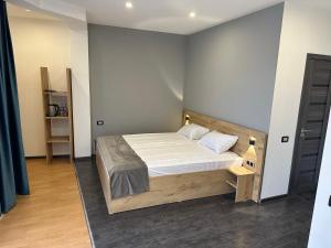 Voodi või voodid majutusasutuse Friendly Hotel toas