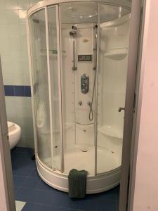 a shower with a glass door in a bathroom at Apollo Apartaments in Zagreb +11 photos