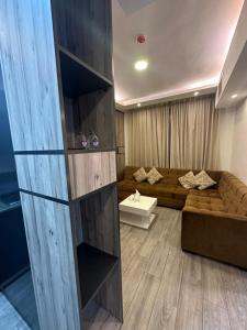 a living room with a couch and a table at apartment for rent khaldi(HA31) in Amman