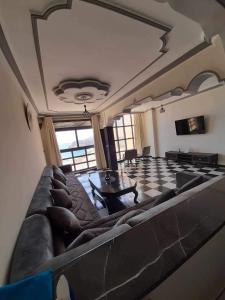 a large living room with a couch and a table at Al-marsa2 in Al Hoceïma