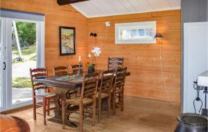 a dining room with a table and chairs at Nice Home In Heggedal With Wifi And 4 Bedrooms 