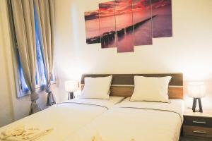 a bedroom with a bed with two white pillows at Nel centro di Locarno vicino a Piazza Grande in Locarno