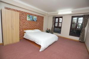Postel nebo postele na pokoji v ubytování Kaji Chhen Homestay
