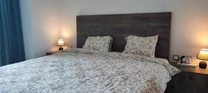 Ένα ή περισσότερα κρεβάτια σε δωμάτιο στο Skynest Residences by Lisa's Paradise A