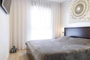 Voodi või voodid majutusasutuse TLV Luxury Modern Apartment City Center toas