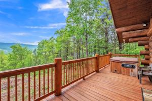 a wooden deck with a grill on it at Royal Views - Private Mountain Top Cabin cabin in Gatlinburg