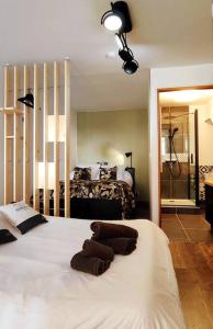 a bedroom with a bed with towels on it at Studio le St O-Zone in Angoulême