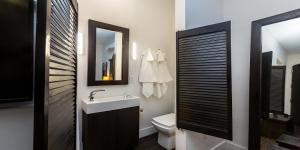 a bathroom with a sink and a toilet and a mirror at Vive Zen Queen Room in Miami +22 photos