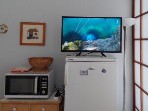 Kuchyň nebo kuchyňský kout v ubytování Studio lumineux proche port & plages