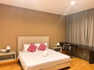 Ένα ή περισσότερα κρεβάτια σε δωμάτιο στο Platinum Suites KLCC