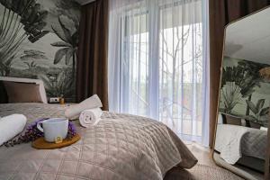 Posteľ alebo postele v izbe v ubytovaní Platán Beach Apartman with lakeview
