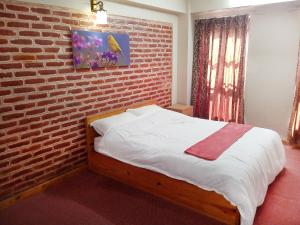 Postel nebo postele na pokoji v ubytování Kaji Chhen Homestay