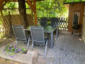 a table and chairs sitting on a brick patio at Ferienhaus Eichler in Bad Gottleuba