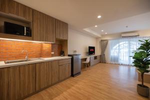 a kitchen with a sink and a counter top at Exoresidence The Heart of Chinatown in Bangkok