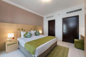 Postel nebo postele na pokoji v ubytování City Stay Prime Hotel Apartments - Al Barsha