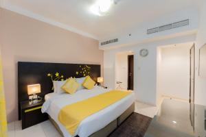Postel nebo postele na pokoji v ubytování City Stay Prime Hotel Apartments - Al Barsha