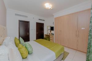 Postel nebo postele na pokoji v ubytování City Stay Prime Hotel Apartments - Al Barsha