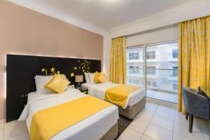 Postel nebo postele na pokoji v ubytování City Stay Prime Hotel Apartments - Al Barsha + 37 fotografií