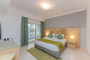 Postel nebo postele na pokoji v ubytování City Stay Prime Hotel Apartments - Al Barsha