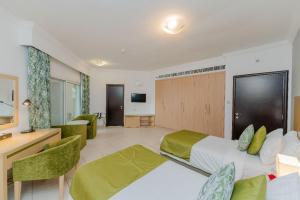 Postel nebo postele na pokoji v ubytování City Stay Prime Hotel Apartments - Al Barsha