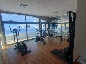 a gym with a view of the ocean in a building at La Mongie Appartement duplex 2 à 7 personnes in Bagnères-de-Bigorre