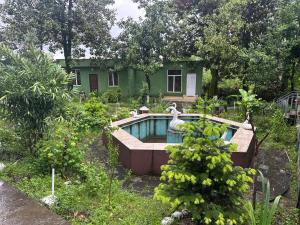a house with a swimming pool in the yard at Hotel In Georgia in Zestafoni