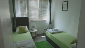 Ένα ή περισσότερα κρεβάτια σε δωμάτιο στο Apartments Bestak