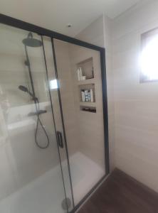 a shower with a glass door in a bathroom at Single bedroom in quiet neighbourhood in Mount Vernon