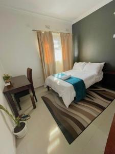 Ένα ή περισσότερα κρεβάτια σε δωμάτιο στο Busisiwe's RM Home